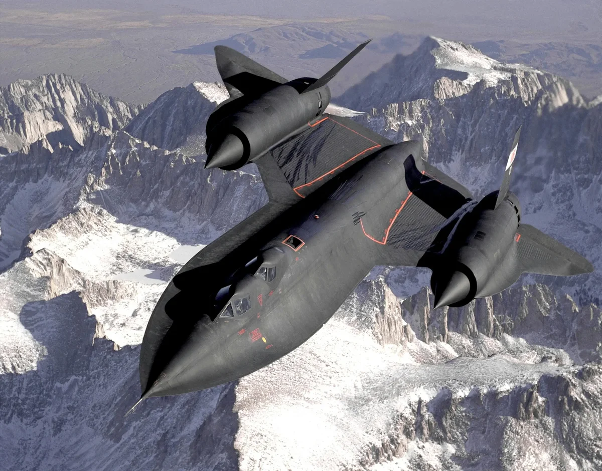 SR-71 Blackbird stealth jet flying above snow-covered mountains